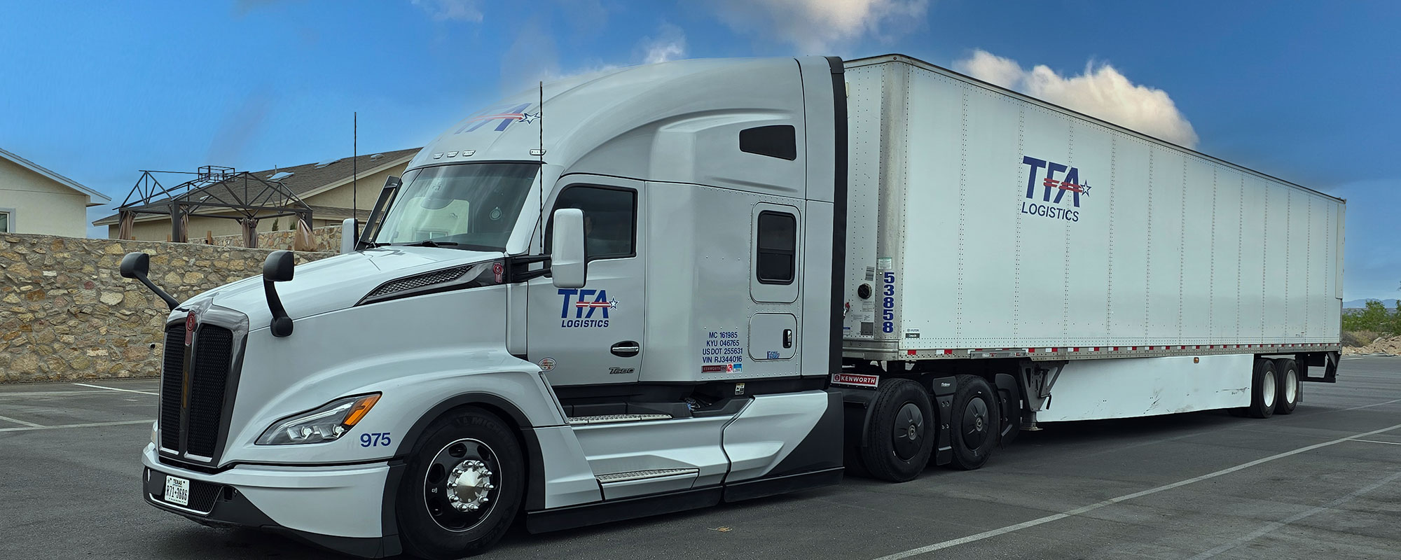 A TFA Logistics tractor and trailer at a terminal yard